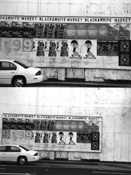 Black and white photo of a car and urban posters